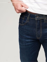 Синий - Хлопковые джинсы узкого кроя прямого кроя Superdry - Изображение 4 из 9