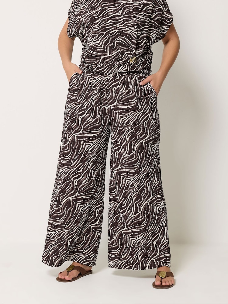 Yours Curve Brown/Print Wide Leg Trousers - Image 1 of 2 Yours Curve Brown/Print Wide Leg Trousers - Image 1 of 2