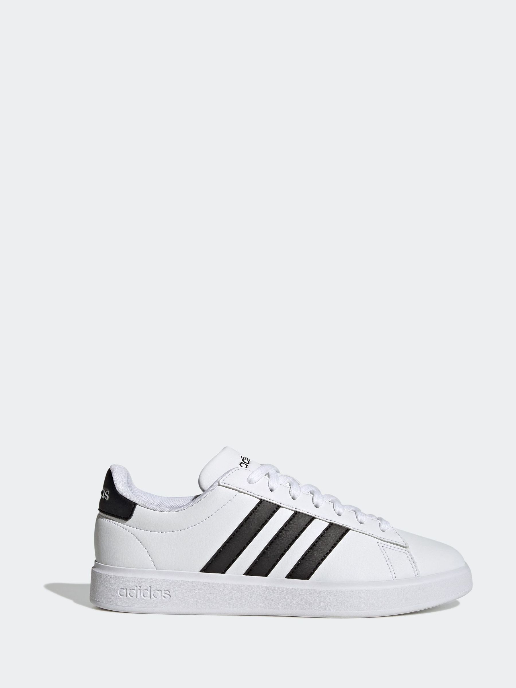 White adidas trainers with black stripes on sale