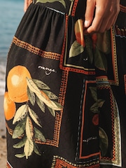 Schwarz mit Fruchtprint - Schulterfreies Sommerkleid mit Neckholder - Bild 5 von 7