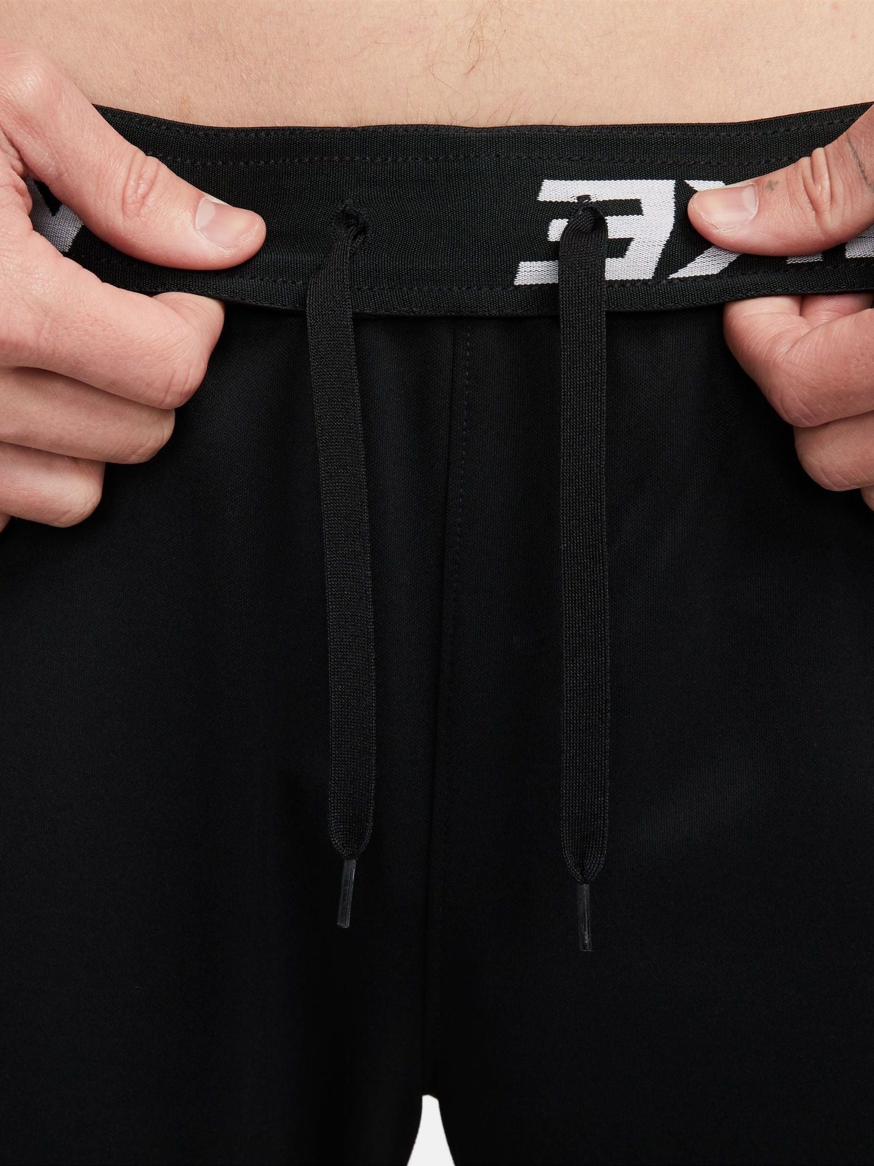 nike training tall therma tapered joggers in black