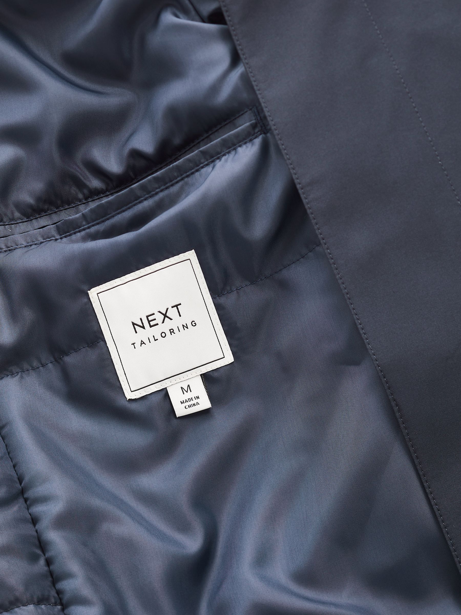 Buy Navy Shower Resistant Four Pocket Funnel Neck Coat from Buy Navy Shower Resistant Four Pocket Funnel Neck Coat from