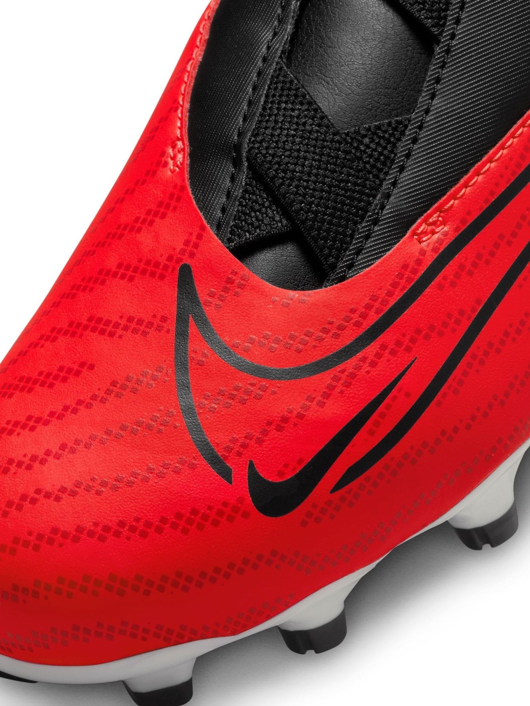 Buy Nike Red Kids Phantom Academy Firm Ground Football Boots from Next Luxembourg