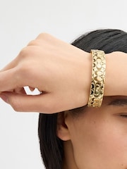 COACH Gold Tone Quilted C Hinged Bangle Bracelet - Image 1 of 6