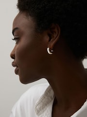 Gold Tone Small Chubby Hoop Earrings - Image 1 of 3