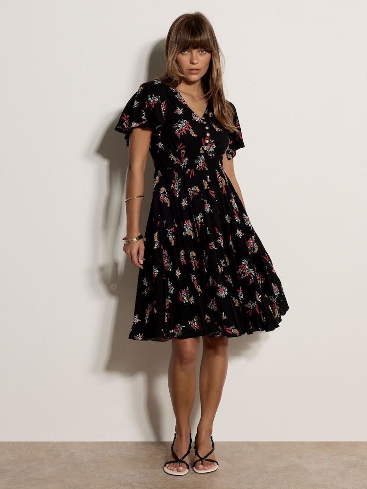 Apricot Black Botanical Floral Smocked Midi Dress - Image 1 of 5 Apricot Black Botanical Floral Smocked Midi Dress - Image 1 of 5