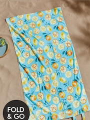 Catherine Lansfield Green Lemon and Orange Print 100% Cotton Beach Towel In A Bag - Image 1 of 4