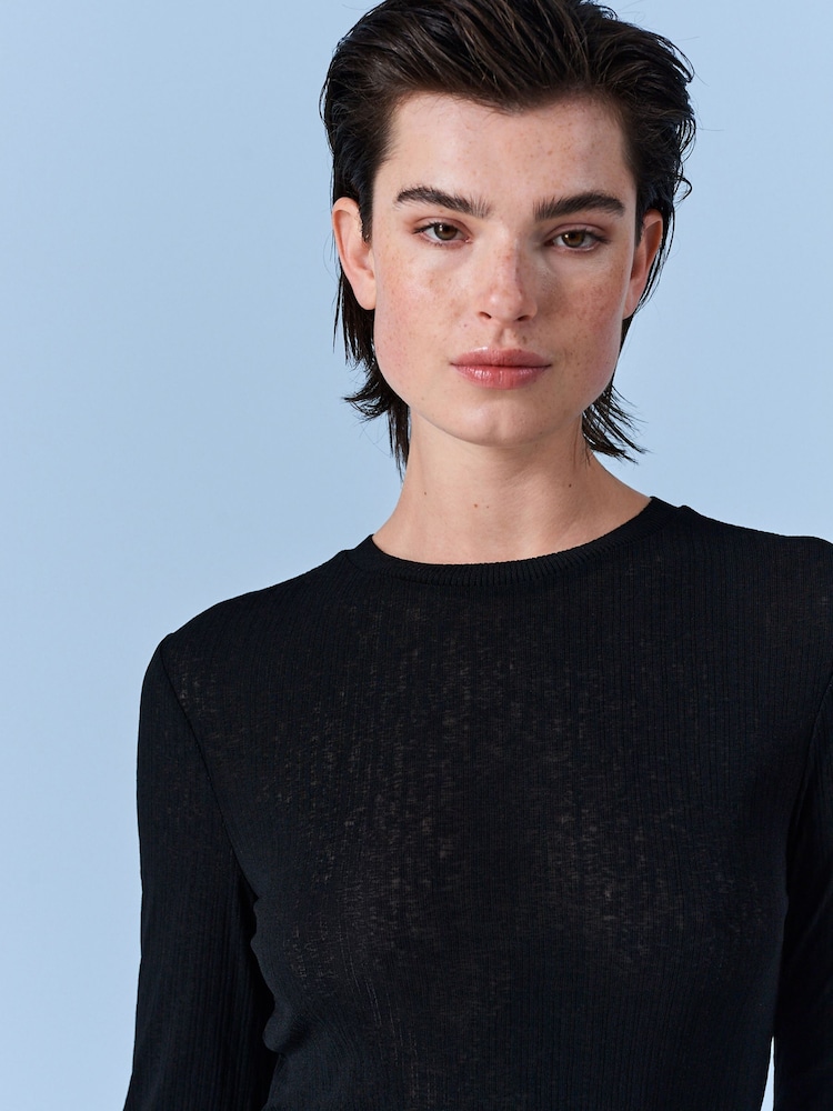 Schwarz - Strukturiertes Langarmshirt - Bild 1 von 7 Schwarz - Strukturiertes Langarmshirt - Bild 1 von 7