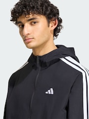 سترة منسوجة مقاومة للرياح تصميم 3 خطوط من adidas Essentials - صورة 2 من 4