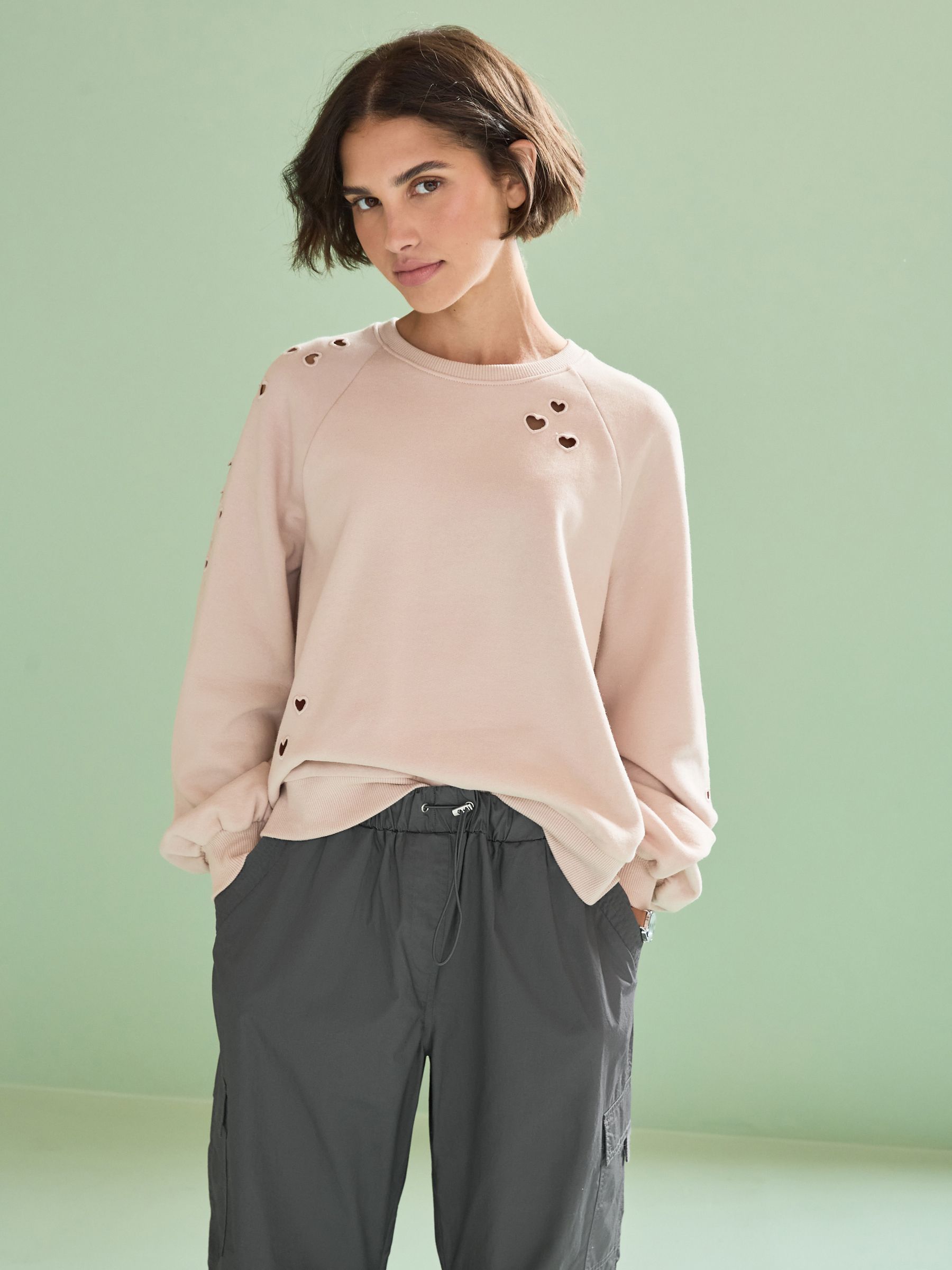 Buy Light Pink Heart Cut Out Detail Sweatshirt from Next Luxembourg
