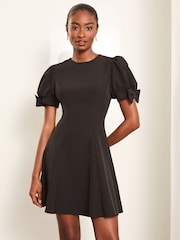 Lipsy Black Bow Detail Puff Sleeve Skater Mini Dress - Image 1 of 4