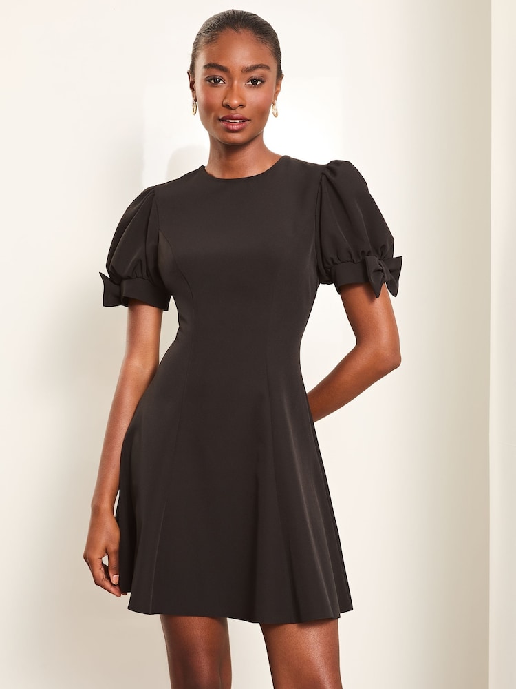 Lipsy Black Bow Detail Puff Sleeve Skater Mini Dress - Image 1 of 4