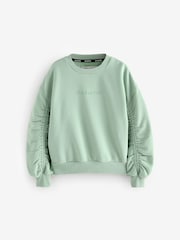 smALLSAINTS Sage Green Girls Oversized Cygni Ruched Sleeve Sweatshirt. - Image 5 of 8