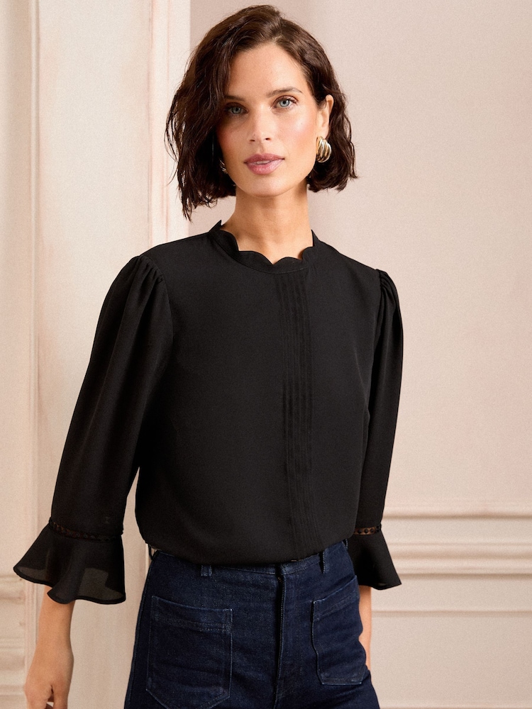 Love & Roses Scallop Pintuck Flute Sleeve Blouse - Image 1 of 4 Love & Roses Scallop Pintuck Flute Sleeve Blouse - Image 1 of 4