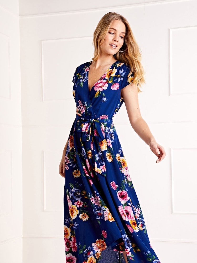Blau - Mela Blumiges Midikleid mit Wickeloptik und abgerundetem Saum - Bild 1 von 4 Blau - Mela Blumiges Midikleid mit Wickeloptik und abgerundetem Saum - Bild 1 von 4