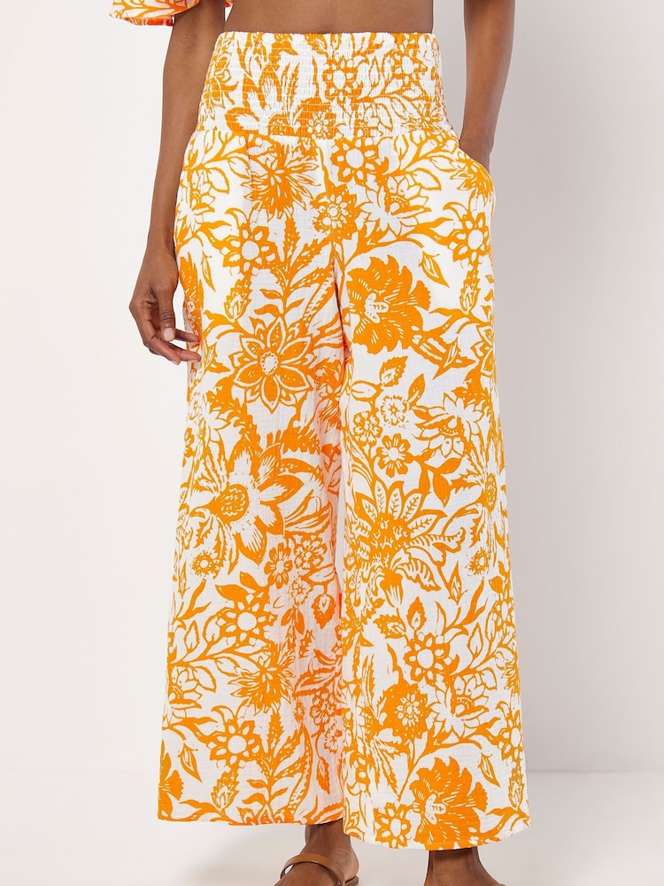 Apricot Orange Floral Print Palazzo 100% Cotton Trousers - Image 1 of 4 Apricot Orange Floral Print Palazzo 100% Cotton Trousers - Image 1 of 4