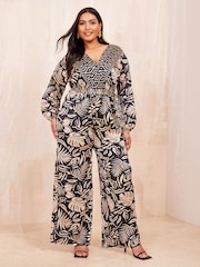Curves Like These Black/White Long Sleeve Wrap Jumpsuit - Image 1 of 4