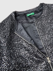 Chaqueta bomber negra con tejido de lentejuelas pequeñas y cremallera con logo de Benetton - Imagen 3 de 3