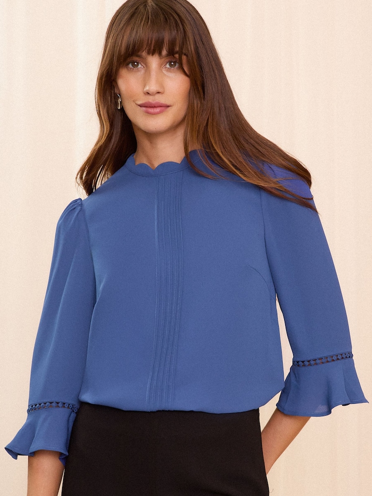 Love & Roses Blue Scallop Pintuck Flute Sleeve Blouse - Image 1 of 4