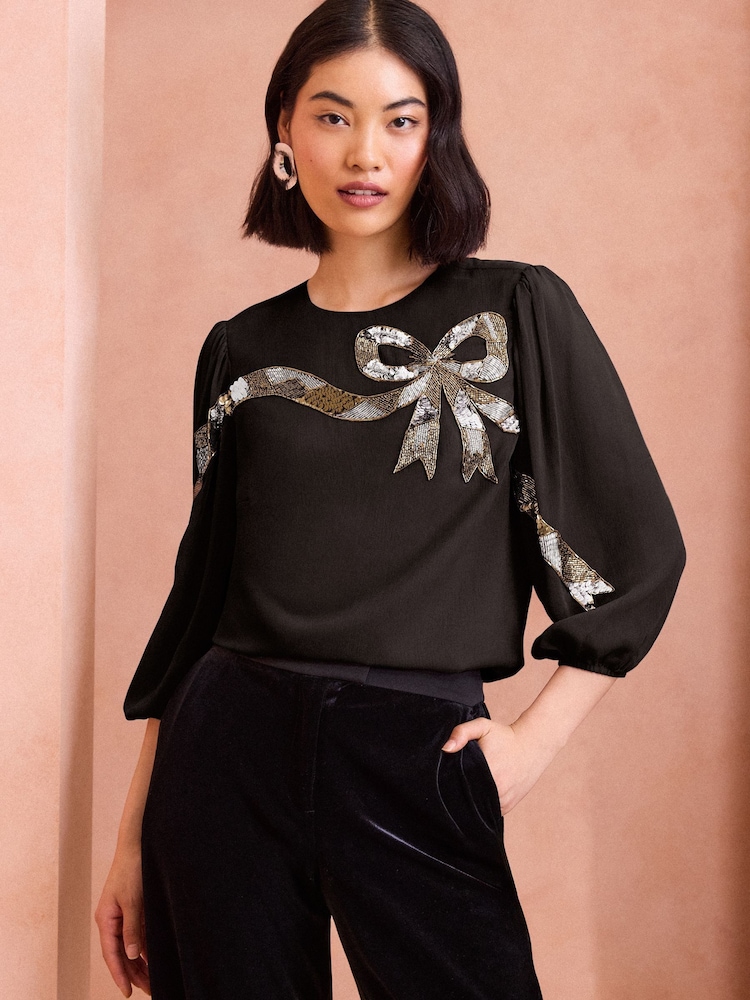 Love & Roses Black Sequin Bow Design Short Sleeve Blouse - Image 1 of 4