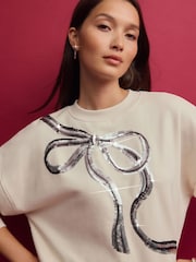 Ecru/Silver Christmas Sparkle Sequin Front Bow Graphic Crew Neck Sweatshirt - Image 1 of 8
