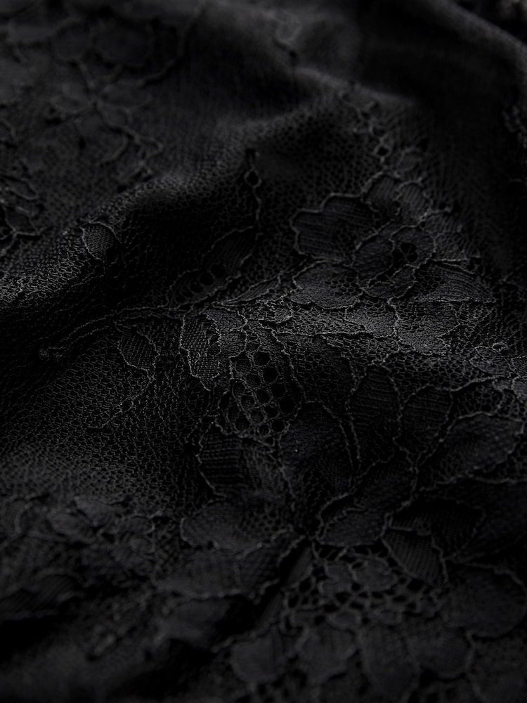 Schwarz - Langarm-Minikleid mit Spitzen- und Rüschendetails - Bild 7 von 7 Schwarz - Langarm-Minikleid mit Spitzen- und Rüschendetails - Bild 7 von 7