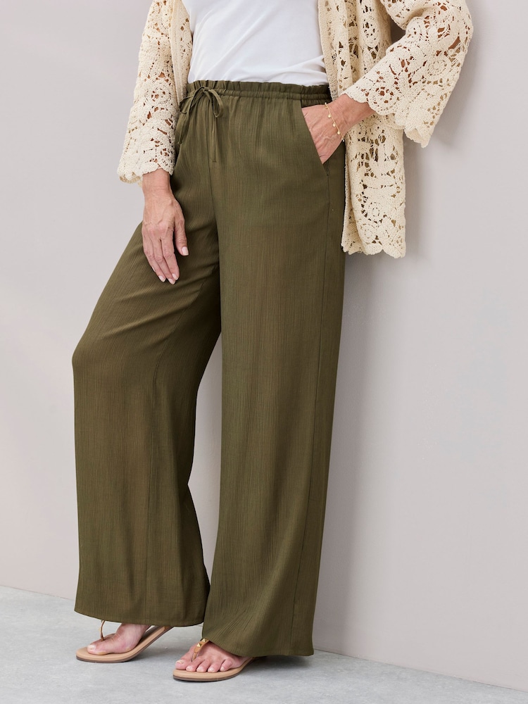 Cotton Traders Green Crinkle Pull On Wide Leg Trousers - Image 1 of 4 Cotton Traders Green Crinkle Pull On Wide Leg Trousers - Image 1 of 4