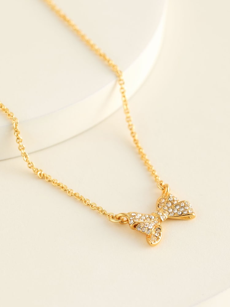 Ted Baker Gold Tone BARSIE Crystal Bow Pendant Necklace - Image 1 of 3 Ted Baker Gold Tone BARSIE Crystal Bow Pendant Necklace - Image 1 of 3