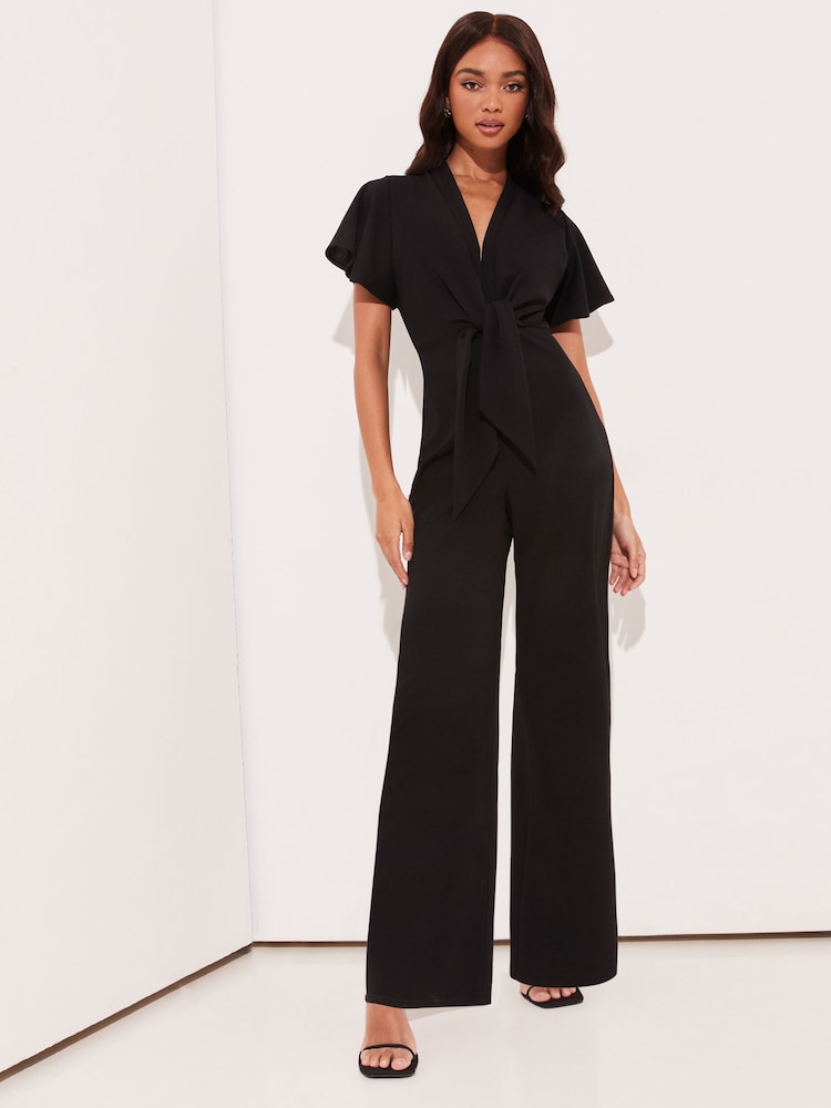 Negro - Mono largo con pernera ancha y lazada delantera con cuello de pico y manga acampanada de Lipsy - Imagen 1 de 4 Negro - Mono largo con pernera ancha y lazada delantera con cuello de pico y manga acampanada de Lipsy - Imagen 1 de 4