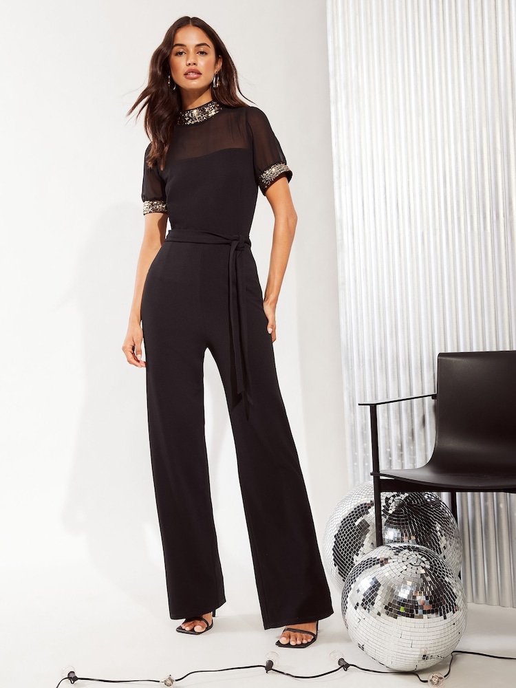 Friends Like These Black High Neck Short Sleeve Sequin Trim Jumpsuit - Image 1 of 4