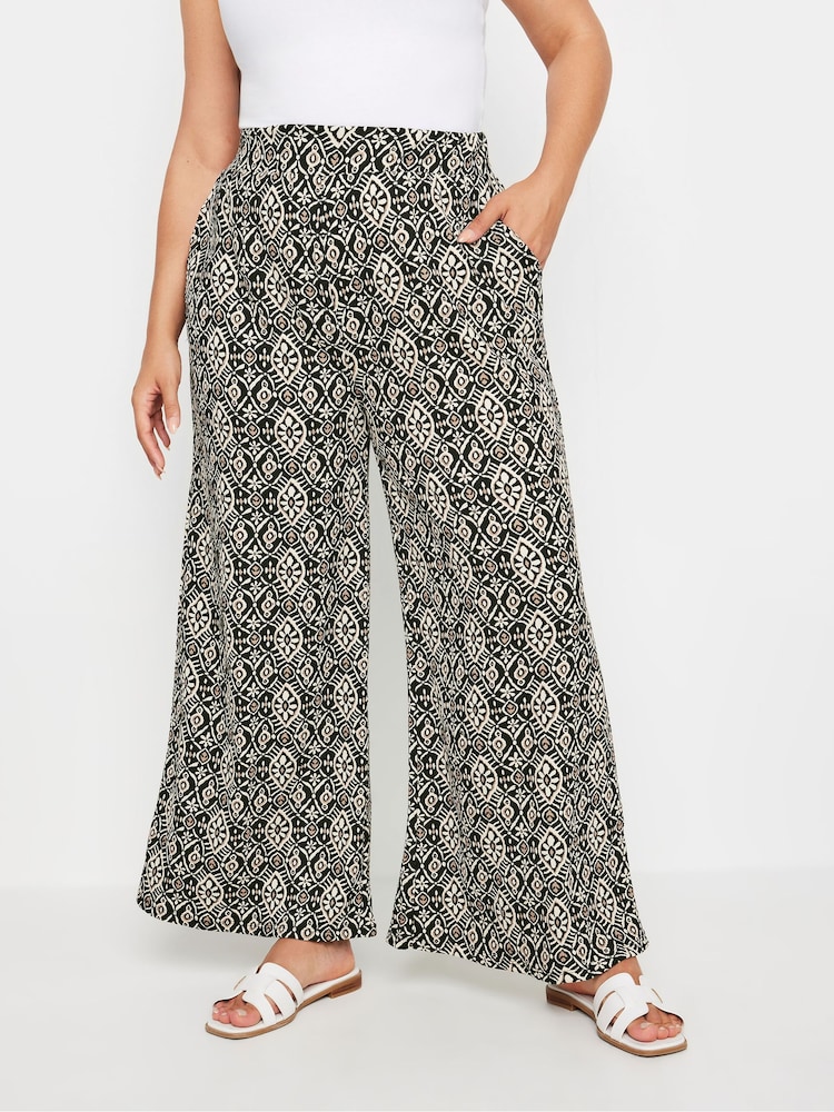 Yours Curve Black Denim Paisley Textured Wide Leg Trousers - Image 1 of 5