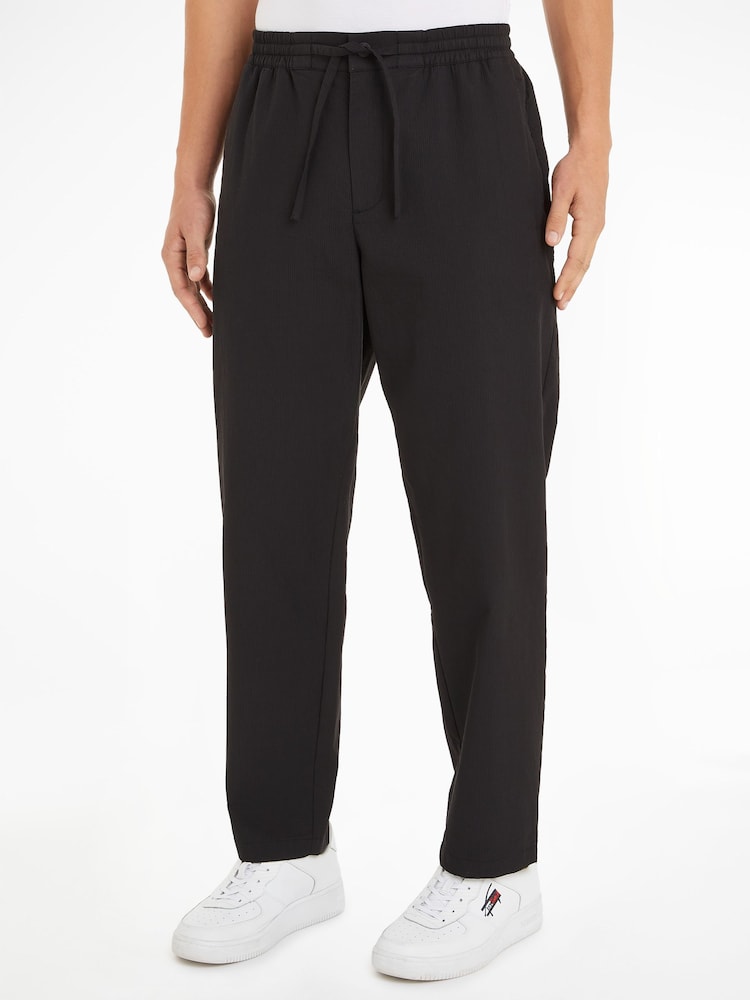 Tommy Jeans Black Windpant Technical Cotton Trousers - Image 1 of 6 Tommy Jeans Black Windpant Technical Cotton Trousers - Image 1 of 6