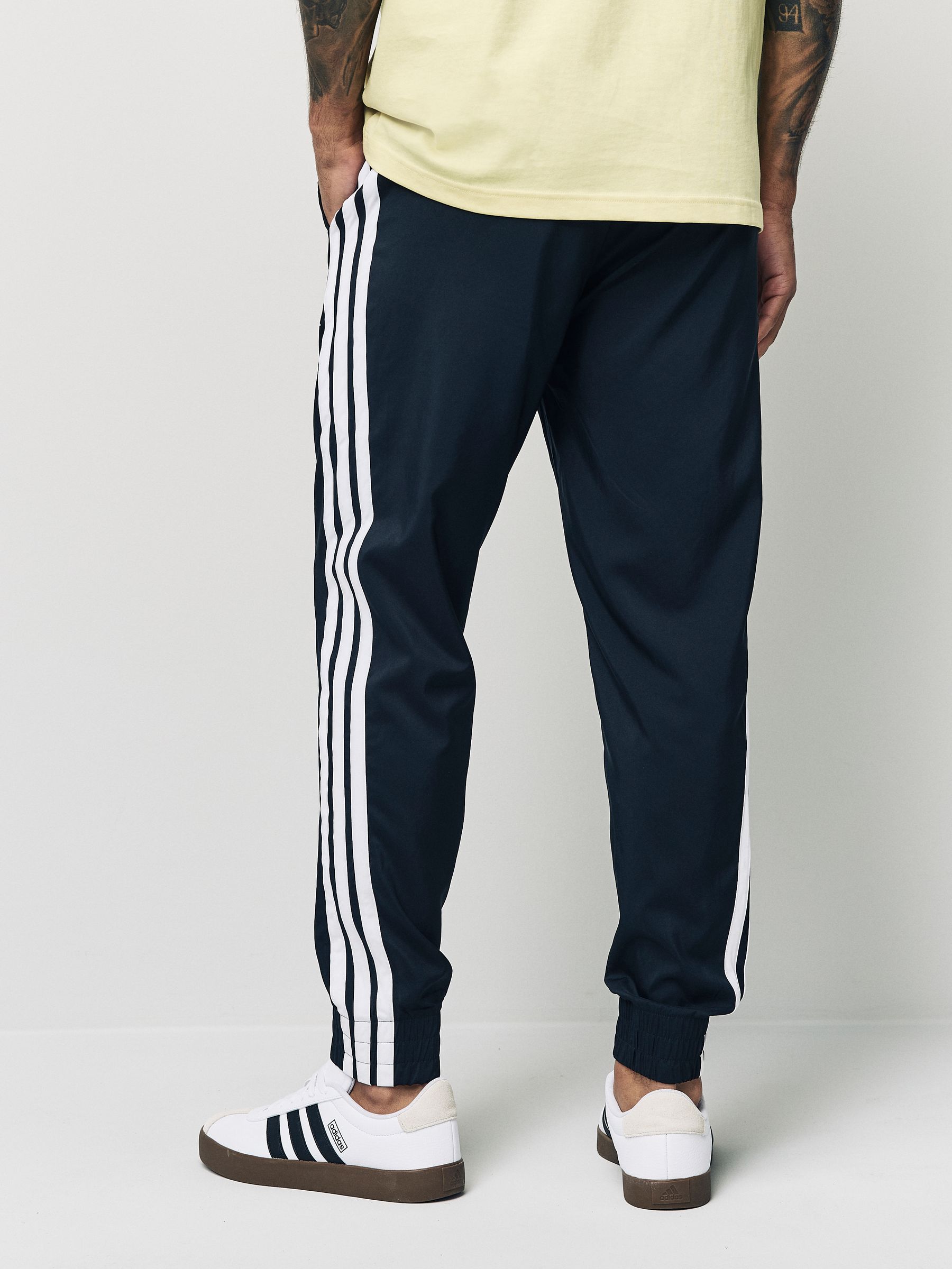 Buy adidas Black Essentials 3-Stripes Woven Joggers from the Next