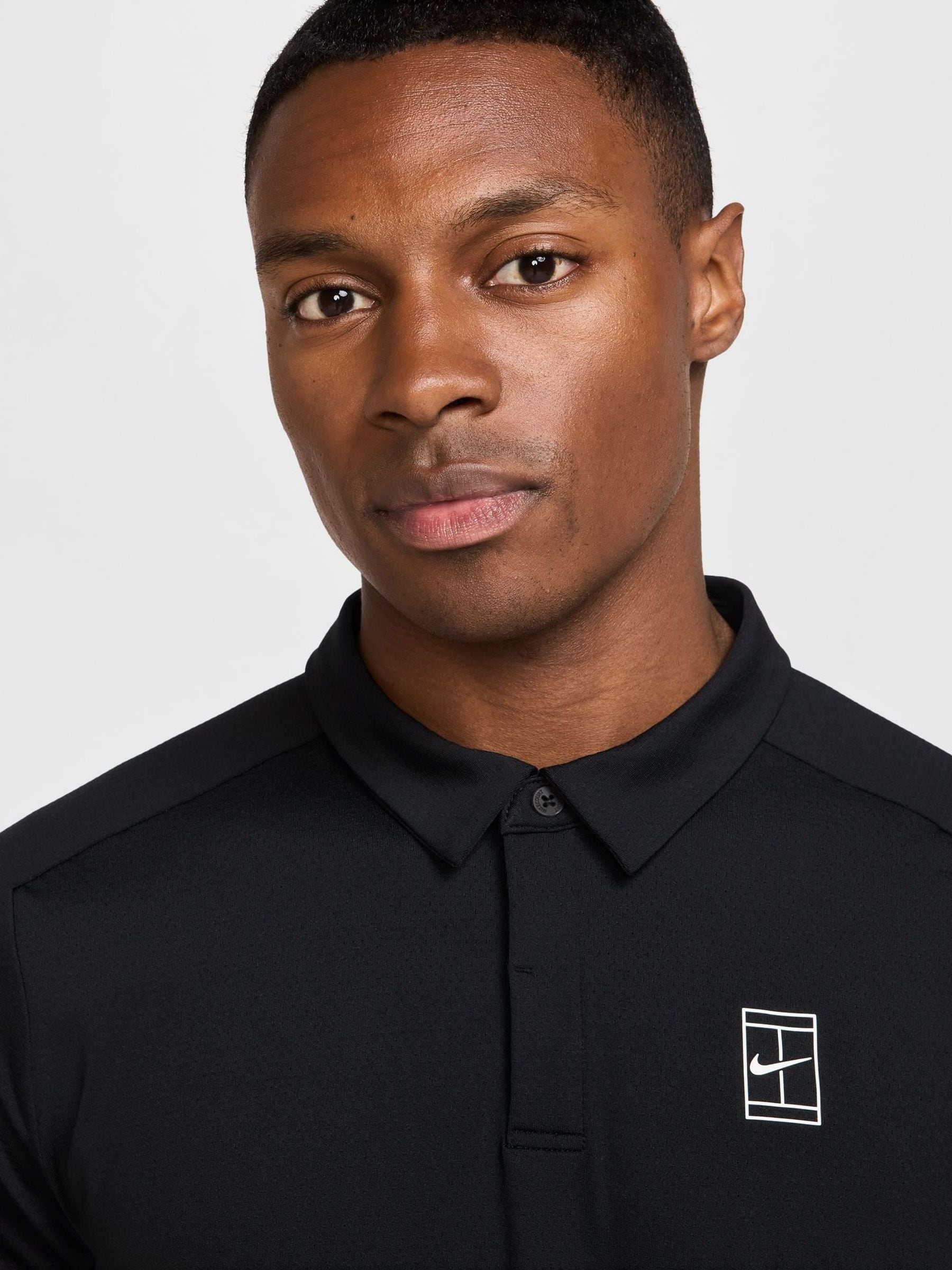 black nike polo shirt