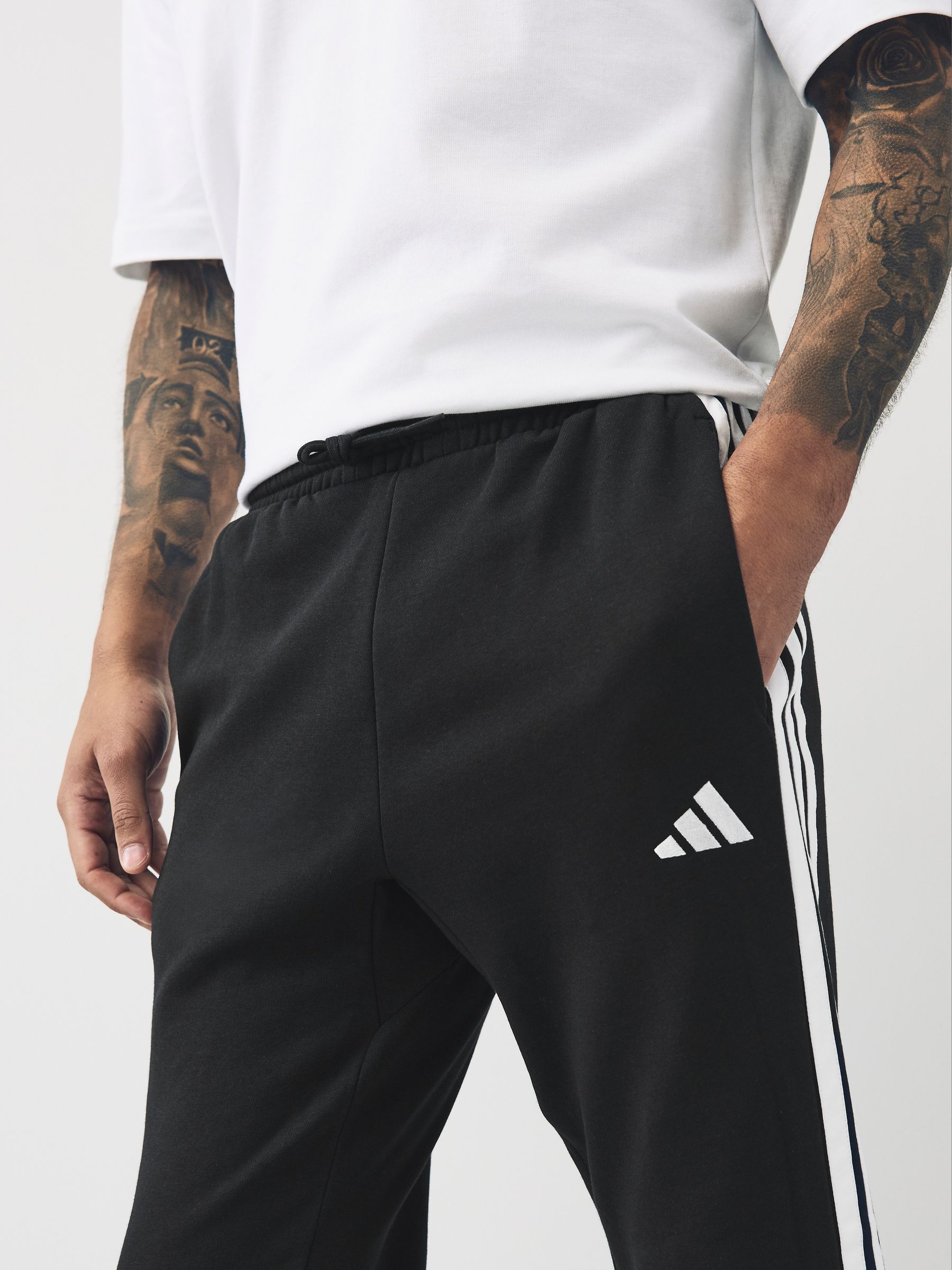 Buy adidas Black Essentials 3-Stripes Fleece Joggers from Buy adidas Black Essentials 3-Stripes Fleece Joggers from