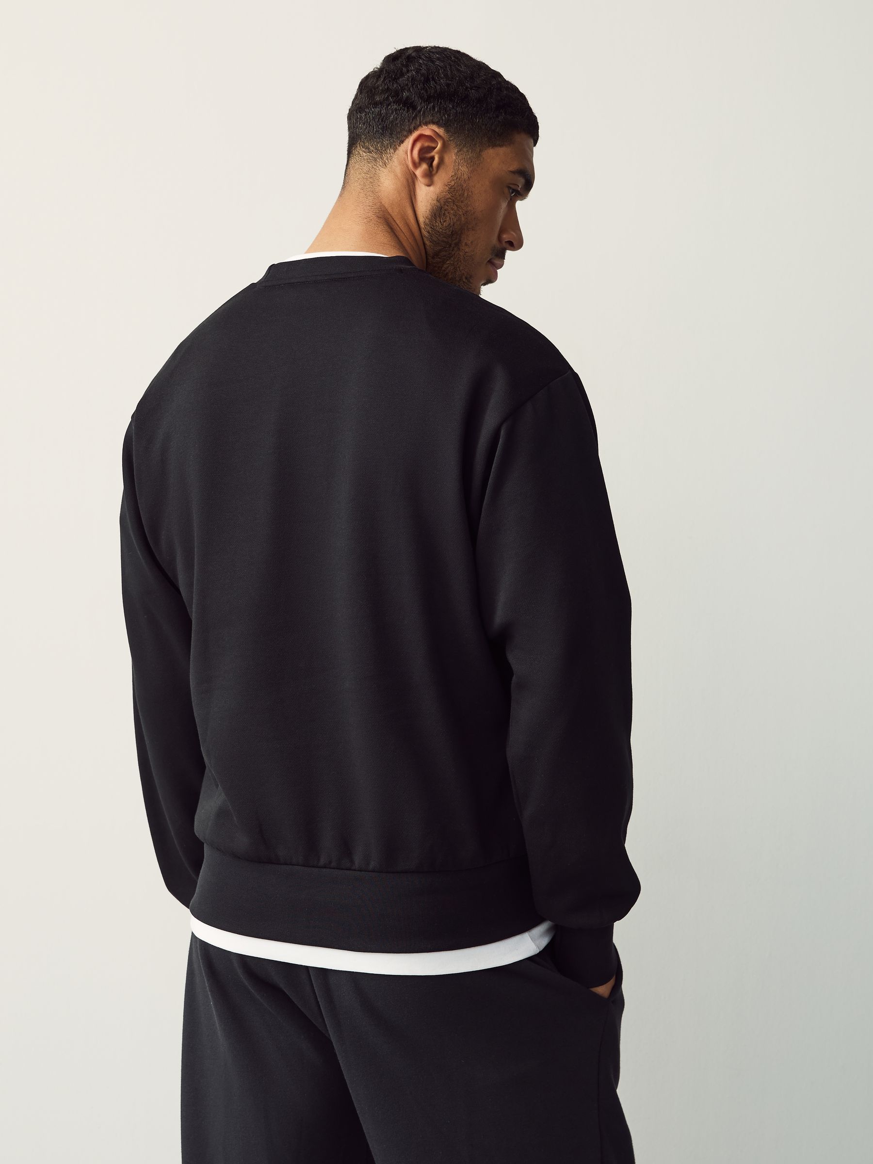 Buy adidas Black Essentials Feelcozy Fleece Sweatshirt from Next