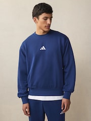 Blå - adidas Essentials Feelcozy Fleece Tröja - Bild 1 av 14
