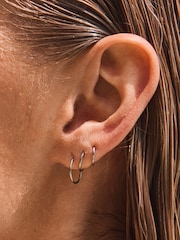 Silver Tone Stainless Steel Graduated Huggie Hoop Earrings 3 Pack - Image 2 of 6