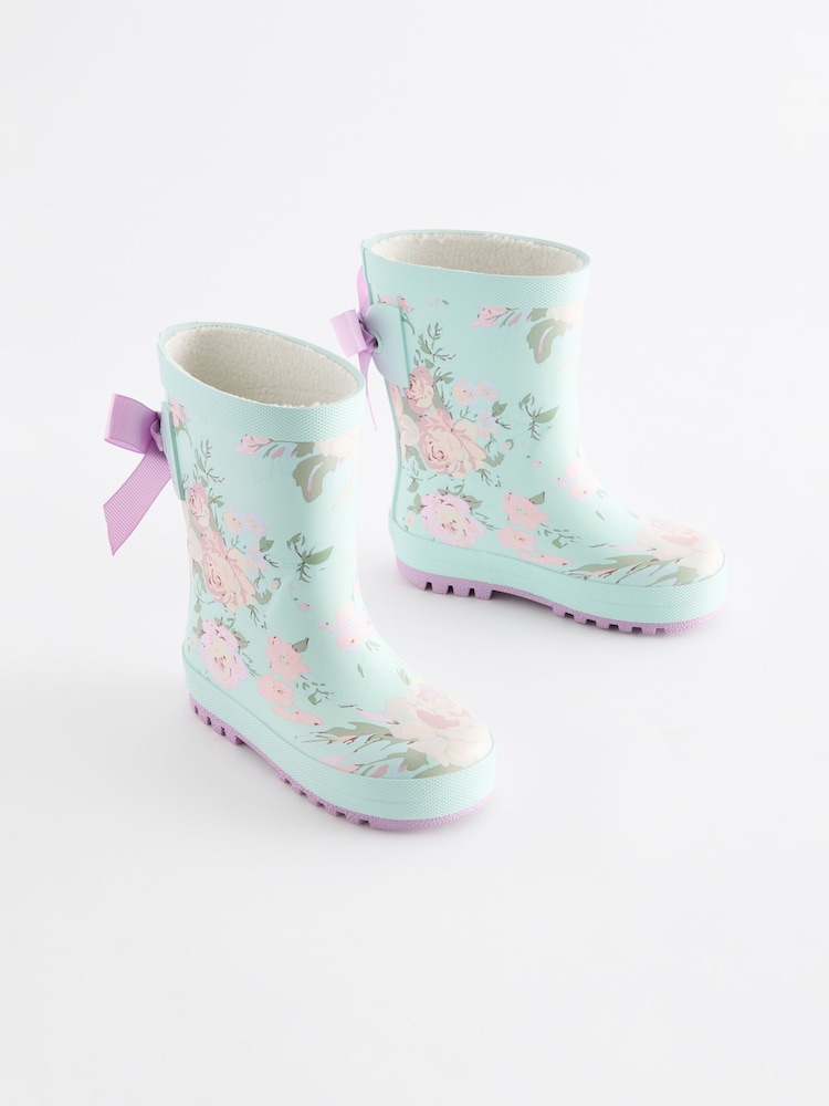 Türkisblau geblümt - Gummistiefel mit Schleife - Bild 1 von 5 Türkisblau geblümt - Gummistiefel mit Schleife - Bild 1 von 5