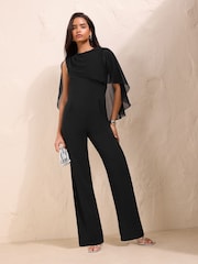 Friends Like These Black Asymmetric Cape Sleeve Jumpsuit - Image 1 of 6