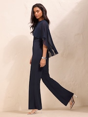 Friends Like These Navy Blue Petite Asymmetric Cape Sleeve Jumpsuit - Image 3 of 5