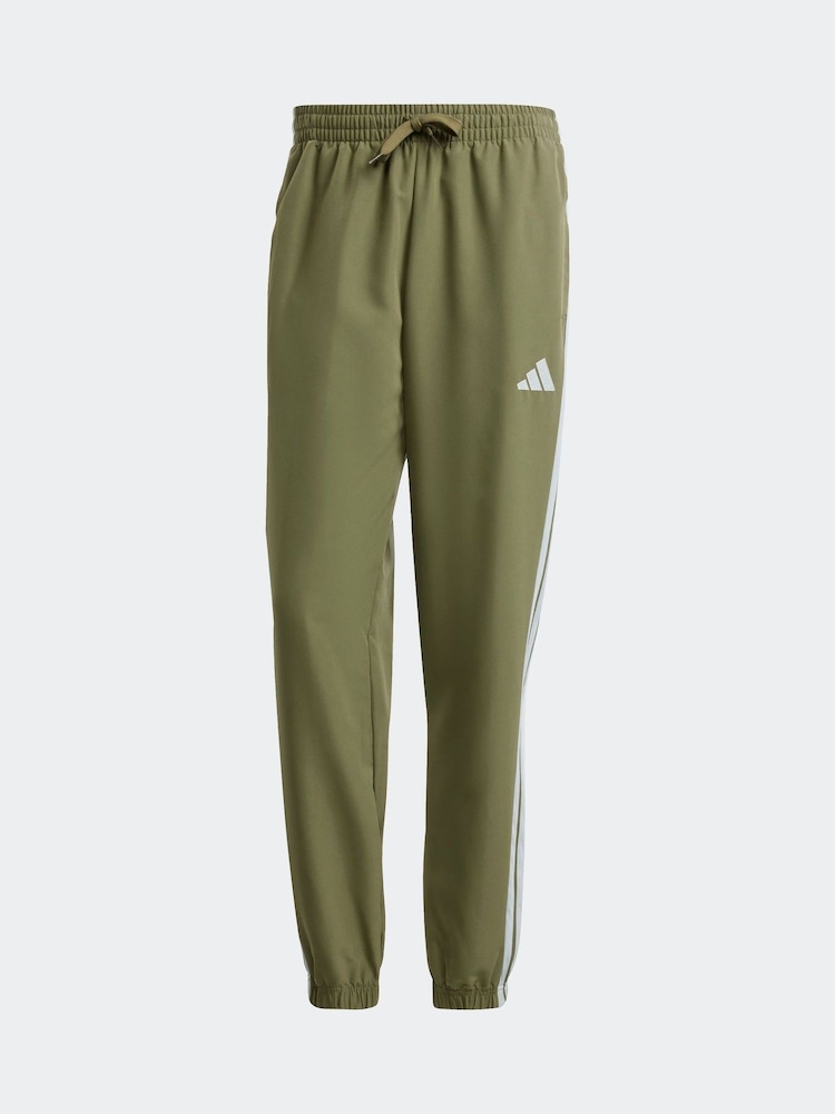 أخضر - بدلة رياضة أساسية منسوجة مُزيّنة بـ 3 خطوط من adidas Sportswear - صورة 8 من 8