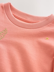 Rosarot - Übergroßes Sweatshirt aus 100 % Baumwolle mit besticktem Blumenmuster und unversäuberten Kanten (3–16 J.) - Bild 8 von 8