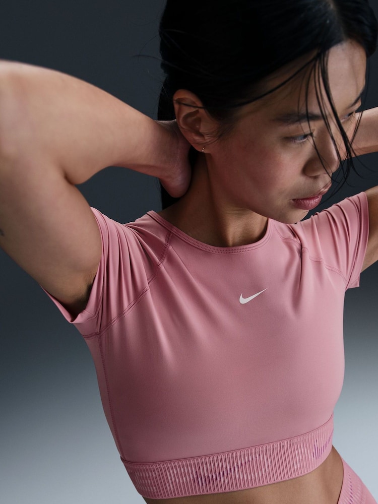 Nike Elemental Pink Pro Dri-FIT Cropped Graphic Short Sleeve Top - Image 1 of 1 Nike Elemental Pink Pro Dri-FIT Cropped Graphic Short Sleeve Top - Image 1 of 1