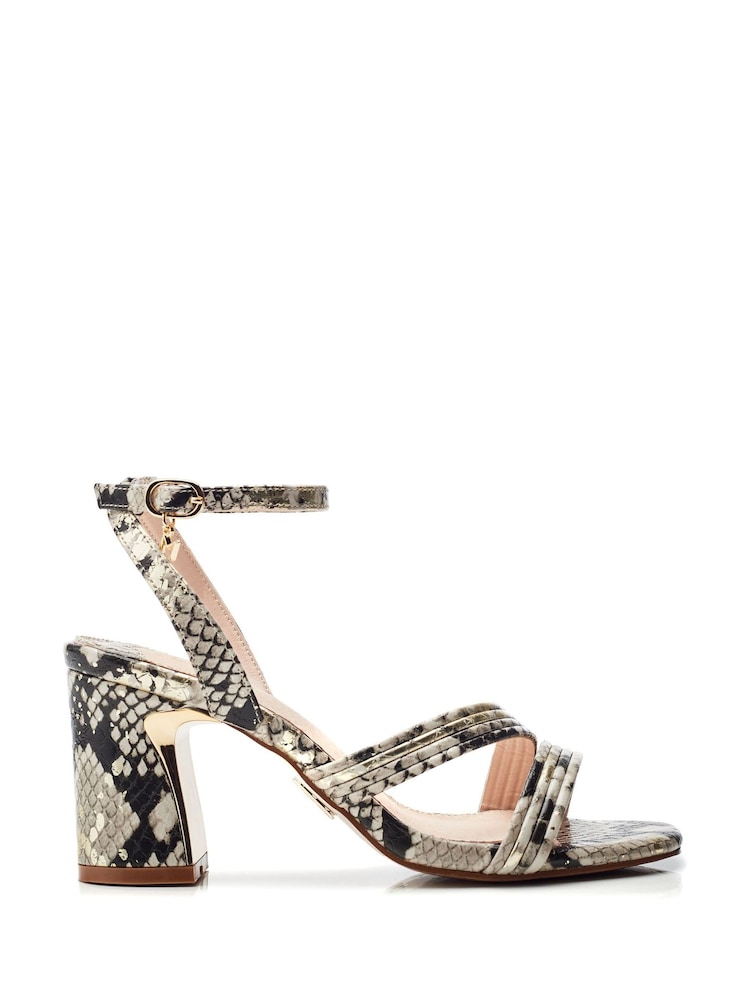 Moda in Pelle Animal Raeya Tubular Strappy Swoosh Heel Sandals - Image 1 of 4 Moda in Pelle Animal Raeya Tubular Strappy Swoosh Heel Sandals - Image 1 of 4