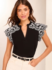 Lipsy Black Embroidered Shoulder Jersey Ruffle Blouse - Image 1 of 4