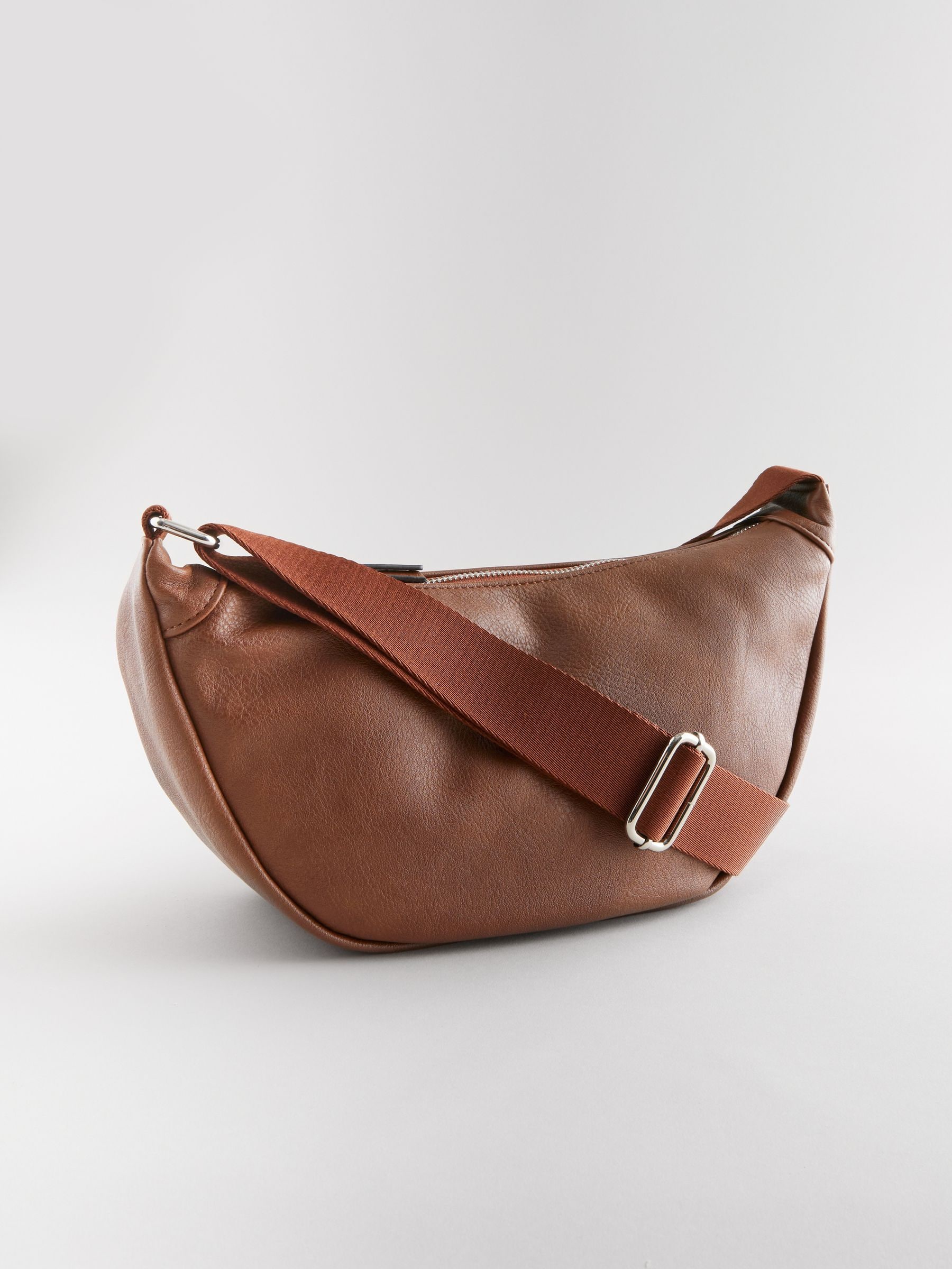 Tan sling bag outlet