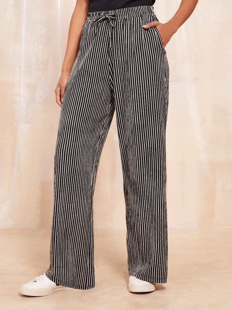 Friends Like These Black Wide Leg Crinkle Jersey Printed Elasticated Waist Trousers - Image 1 of 4
