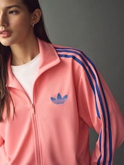 وردي - رداء علوي رياضي فضفاض Firebird من adidas originals - صورة 4 من 6