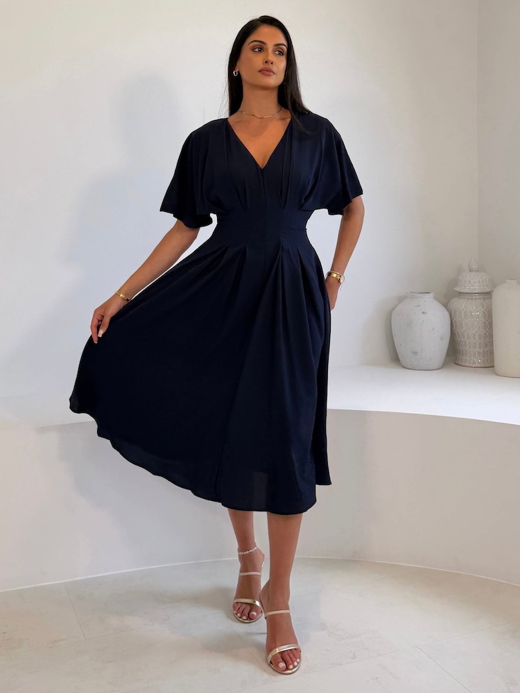 Girl In Mind Blue Laura V-Neck Short Sleeve Flowy Navy Midi Dress - Image 1 of 5 Girl In Mind Blue Laura V-Neck Short Sleeve Flowy Navy Midi Dress - Image 1 of 5